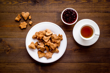 Freshly baked butter cookies with tea, top view