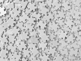 Messy white jigsaw puzzle pieces