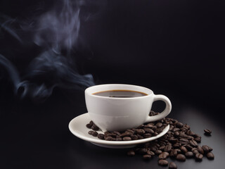 Fototapeta premium A cup of hot black coffee on black background with hot steam