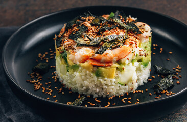 Spicy shrimp sushi stacks with layers of sushi rice, cucumbers and avocado spicy shrimp and furikake