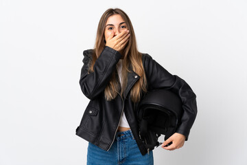 Obraz premium Young Woman holding a motorcycle helmet over isolated white background with surprise facial expression