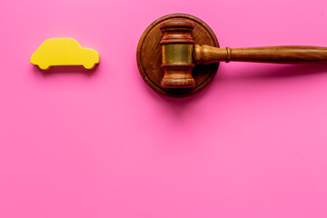 Car shape with judge gavel. Driving and insurance law concept