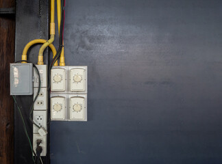 Old Multiple electricity adapter on wall plugs risk overload and danger in house