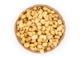 Top view dried lotus seeds pile in bamboo basket isolated on white background, lotus seeds Vietnam
