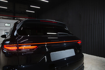 Obraz premium Car detailing series : Closeup blue car lamp