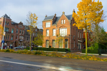 Street view of typical road and house in Amsterdam, Netherlands.