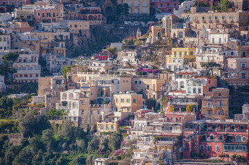 Fototapeta na wymiar Colored Amalfi houses on hills leading down to coast, Campania, Italy.