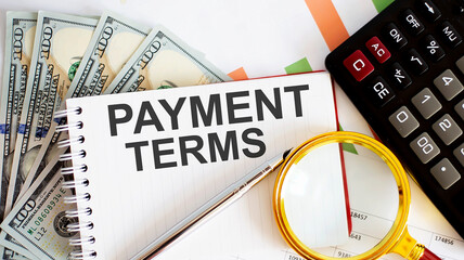 Word writing text PAYMENT TERMS . Business concept with chart, dollars and office tools