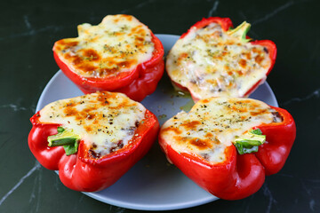 Plate of Mouthwatering Homemade Stuffed Bell Peppers  Isolated on Black Background
