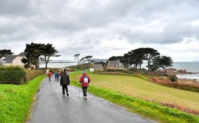 Senior hikers on a path at seaside in Brittany. France