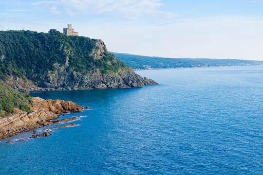 Livorno, Tuscany, Italy: Beach and cliffs of calafuria. The tower indicates the cliff under the Aurelia bridge: a beautiful sea, a classic diving destination.