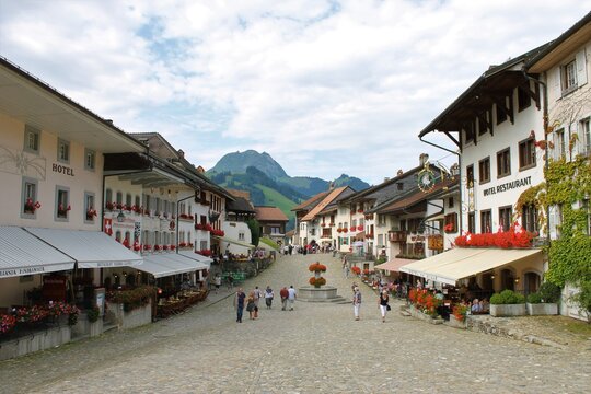 Medieval Swiss Town Square with Fountain and Mountain View in Gruy&egrave;res