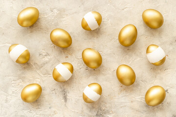 Pattern of golden eggs. Easter decoration. Wealth and good luck concept. Overhead view
