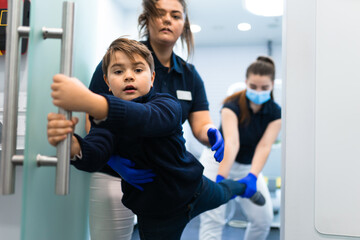 Scared teenager trying to escape from the dentist's office. Fear of doctors concept