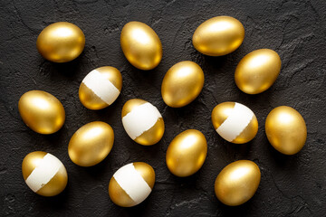 Pattern of golden eggs. Easter decoration. Wealth and good luck concept. Overhead view