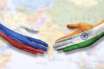 Russia and India - Flag handshake symbolizing partnership and cooperation