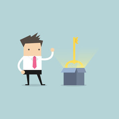 Businessman show the secret key to success that is in the cardboard box.