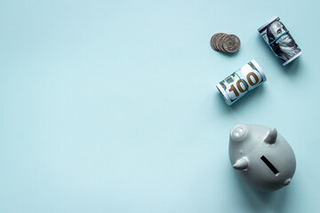 Saving money concept. Piggy bank with cash money and coins. Top view