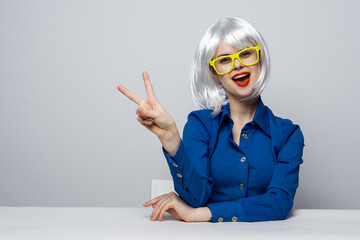 emotional Woman in a White wig yellow glasses red lips Glamor cosmetics 