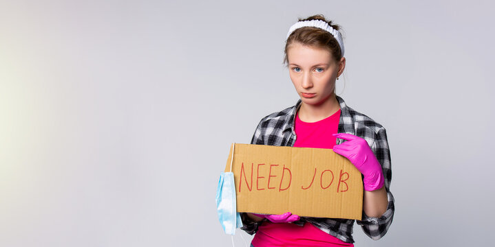 Banner. Sad, Dizzy, Caucasian Woman, A Cleaning Maid Search A New Workplace After Pandemic Quarantine. Need A Job Placard With Medical Protective Mask On Gray Background With Advertising Area