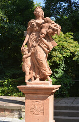 Marburg, Germany 08-21-2013 mother with kids sculpture in a public garden