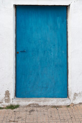Obraz na płótnie Canvas Blue painted door in southern Andalusia