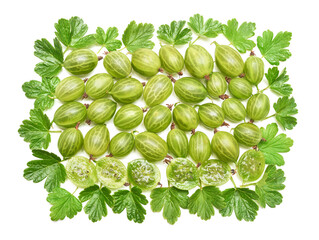 Heap of green gooseberries slice with leaf isolated on white background. Flat lay, top view