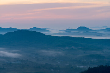 Morning in the mountains. Fog covering the mountain forests.