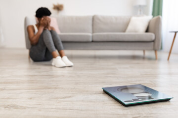 Woman Crying Sitting Near Scales After Slimming Failure At Home