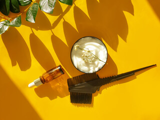 hair mask, comb on a colored background