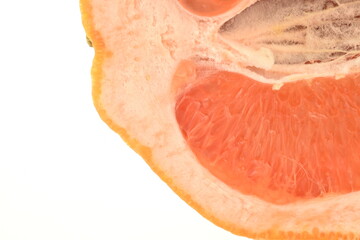 Ripe natural half of a grapefruit, close-up, isolated on white.