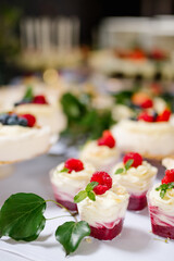 Tasty mousse desserts with jelly and berries in a glass