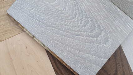 close up wooden laminated flooring samples (focused on grey oak wooden texture). variety of texture...
