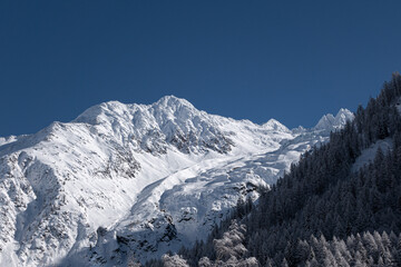 Recently snow covered alpine mountain peaks and glacier in France