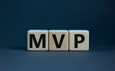 MVP, minimum viable product symbol. Wooden cubes with the word MVP, minimum viable product....