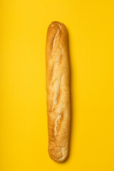 French baguette on yellow background