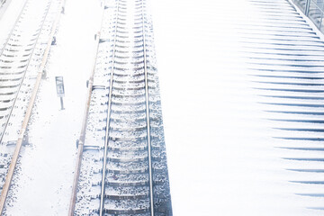 The image of a winter view of the railroad tracks