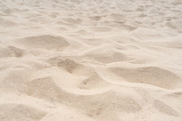 Fototapeta na wymiar Sand on the beach for background. Brown beach sand texture as background.