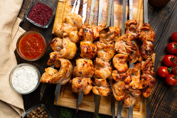 fresh roast chicken shish kebab on cutting board