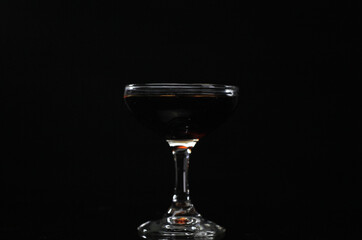 Drink in  a glass with black background