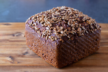 fresh Sunflower seed bread on a wooden cutting board