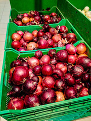 Onions are in boxes in the supermarket