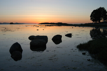 Fototapeta na wymiar Rocks at sunset, Cabbage Island, Southern Gulf Islands, British Columbia, Canada