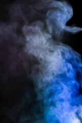 colored pink and blue smoke on black background