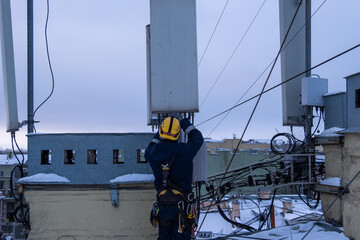 Cell phone installers work on the tower	

