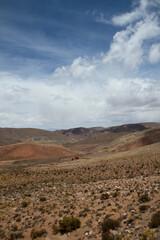 Arid desert background. The colorful canyon, arid valley, sandstone and rocky mountains under a beautiful sky.