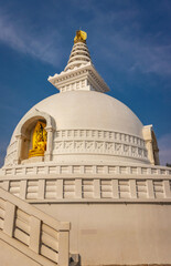 buddhist stupa isolated with amazing blue sky from unique perspective
