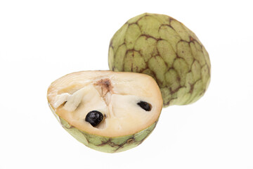 Custard apple (cherimoya) cut in half isolated on white background