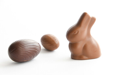 chocolate bunny and chocolate egg isolated on white, with negative space, easter