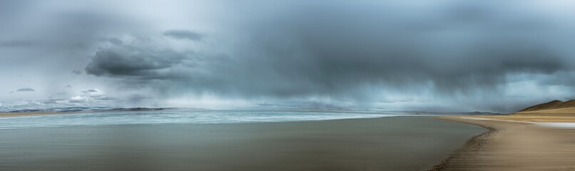 picturesque view of sea surrounded by rocky coast in morning 